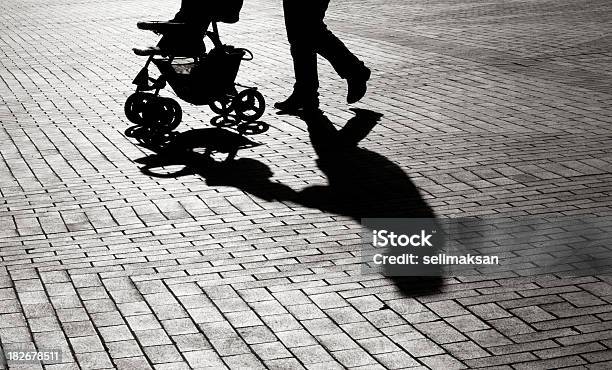 Black And White Shadow Of Baby Carriage On Sidewalk Stones Stock Photo - Download Image Now