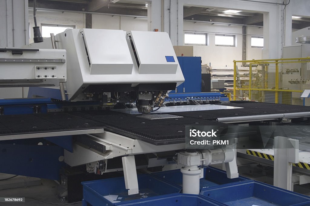 Factory Floor Picture of a Laserpress machine feeding and cutting a sheet of steel.[ Accuracy Stock Photo