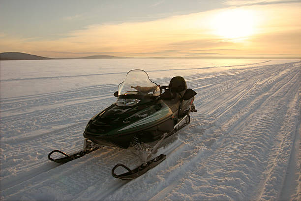 istock snow mobile skidoo parked out on the ice 182679241