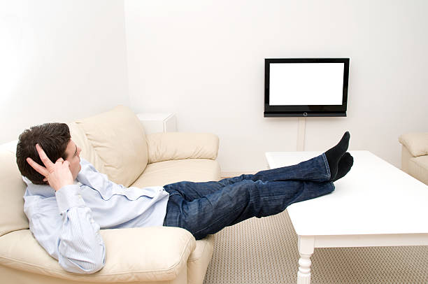 Man Has Feet On His Table While Watching Television Stock Photo - Download Image Now - iStock
