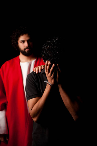 istock Worried man with Jesus behind him 182679342