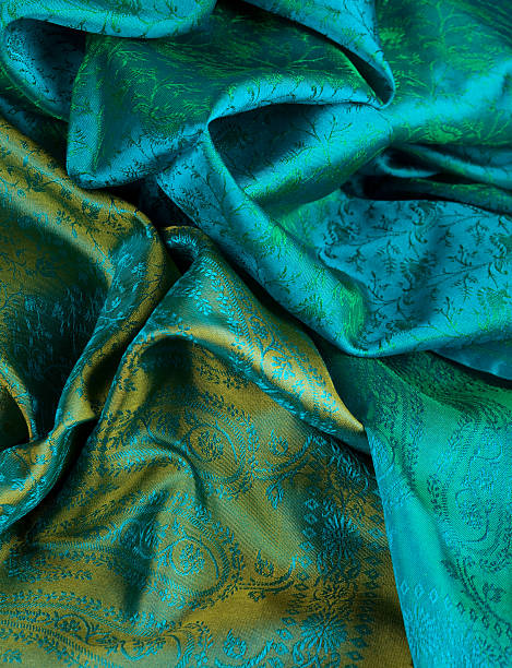 Green and gold fabric in Indian print