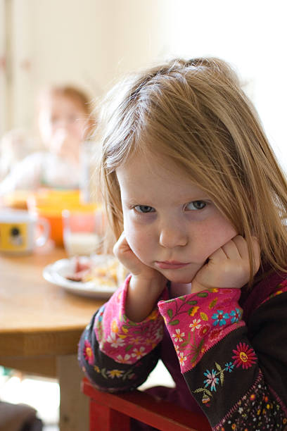 istock Pouty girl doesn't want to eat 182682379