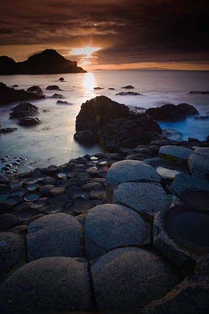 Giants Causeway Sunset at the Giants Causeway northern ireland photos stock pictures, royalty-free photos & images