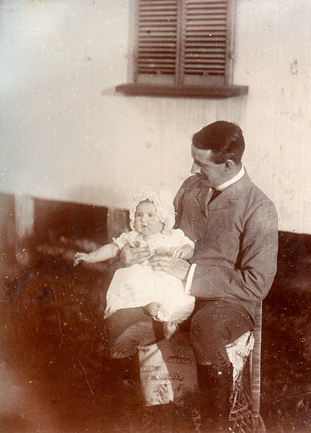 Edwardian father and child Vintage photograph of a father with his baby from the late victorian early edwardian period. England Circa 1900 to 1910 edwardian style photos stock pictures, royalty-free photos & images