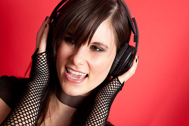 istock Happy Rocker Girl Singing While Wearing Headphones 182682780