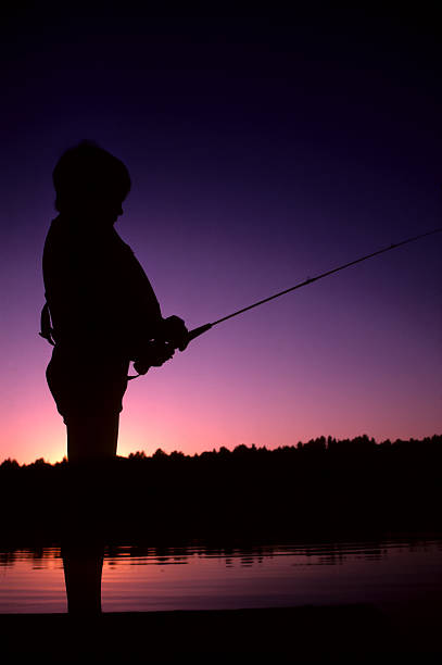 istock little boy fisherman 182682855