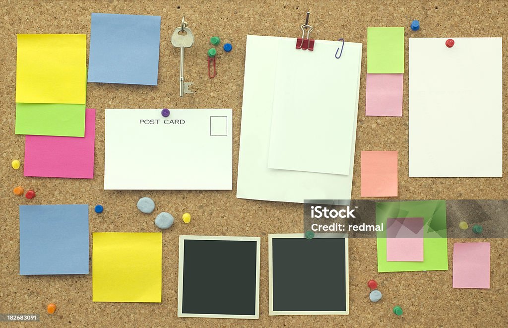 note board "notice board  with bright postits and blank paper,postcards and photos." Bulletin Board Stock Photo