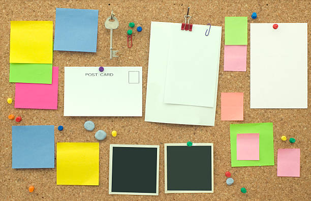 note board "notice board  with bright postits and blank paper,postcards and photos." bulletin board photos stock pictures, royalty-free photos & images