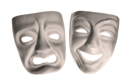 Classic comedy-tragedy theater masks isolated on white.