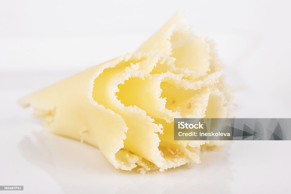 Girolle on a white plate "Close-up shot of rosette, also called Girolle, from TAte de Moine cheese." Cheese Stock Photo