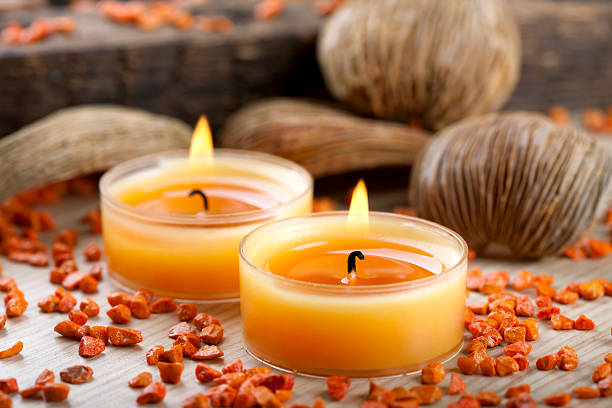 istock Small orange candles and stones decoration 182684009