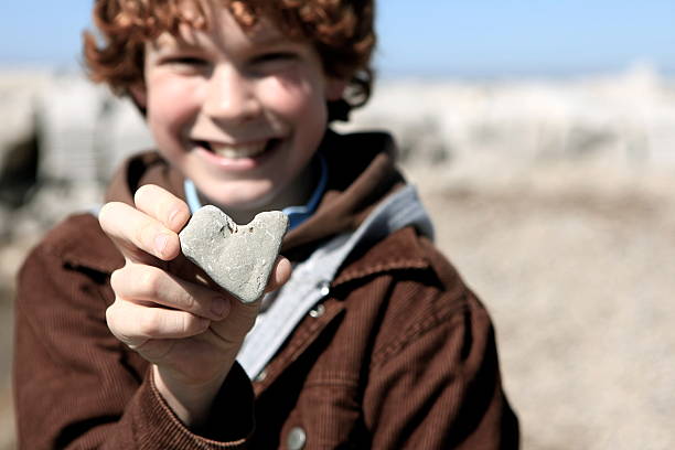 istock Happy Boy with Heart-Shaped Rock 182684305