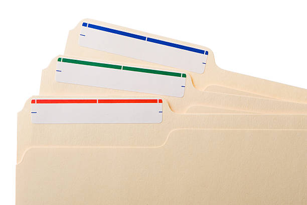 three manila folders with colored labels - akte envelop stockfoto's en -beelden