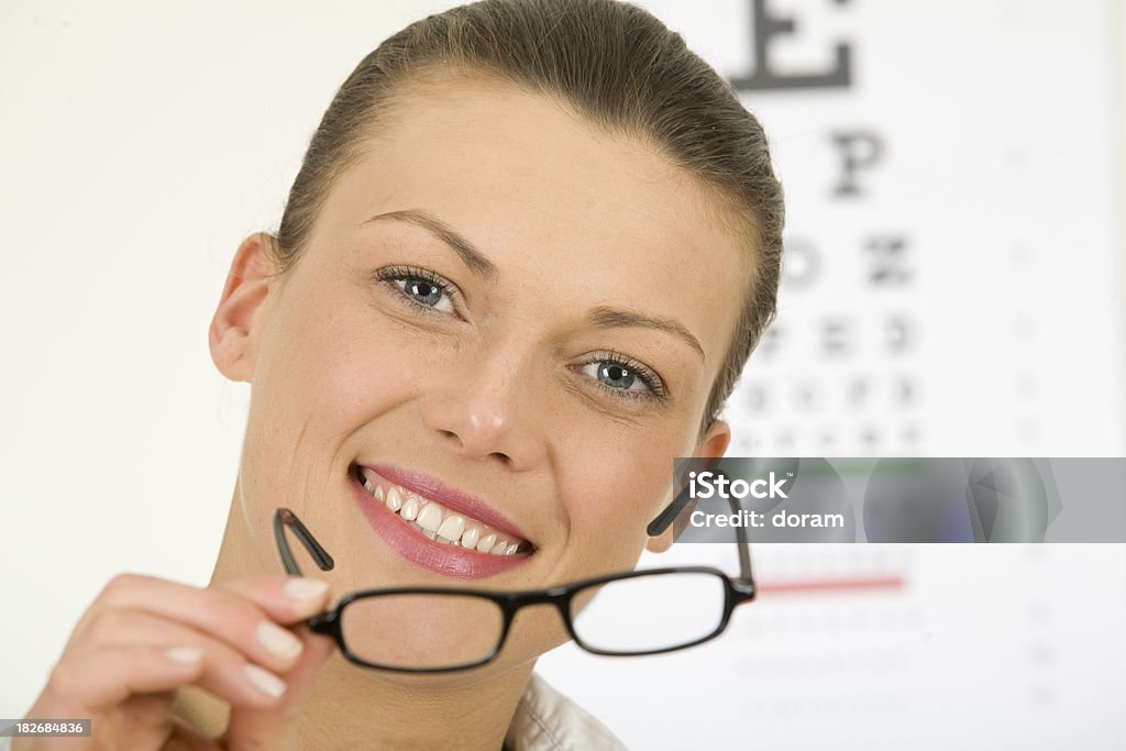 young woman wears trendy glasses young woman wears trendy glasses she has chosen. Adult Stock Photo