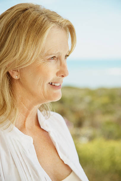 istock Happy mature female looking away in thought 182685242