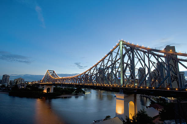 istock Lit up bridge over water in Brisbane at dusk 182686451