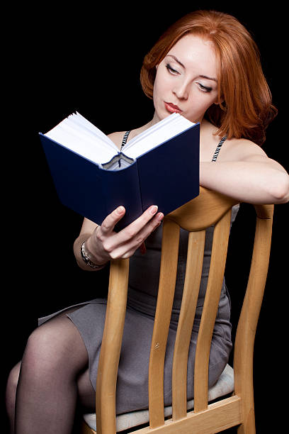 istock Red Head Business Woman: Reading 182686551