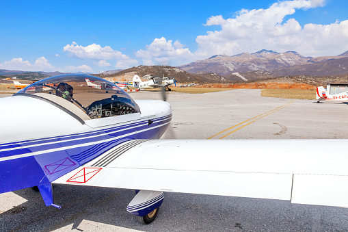 sports plane starting into the blue, white and golden sky