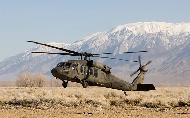 Close up of H-60 helicopter landing in the desert stock photo