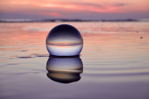istock Crystal ball at beach during dawn 1826872089