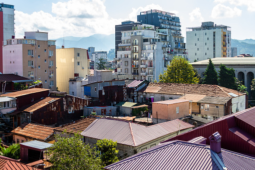 travel to Georgia - above view of one-storey and multy-storey houses in residential district in Batumi city on sunny morning