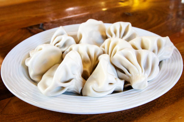 istock big portion of boiled Khinkali in local cafe 1826873999