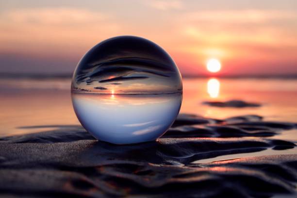 istock Crystal ball at beach during dawn 1826875248