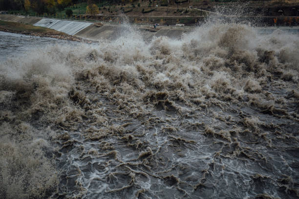 Spillway in Maykop dam, dirty water in river