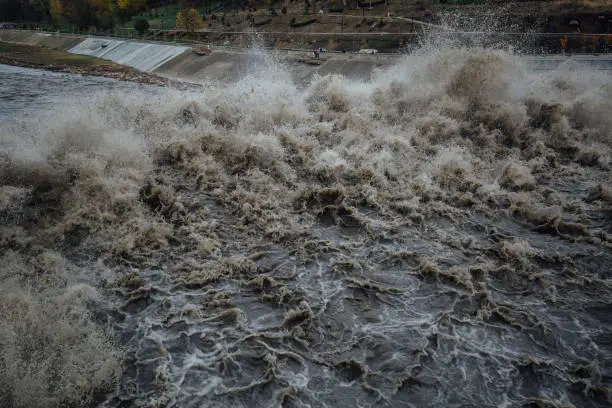 Photo of Spillway in Maykop dam, dirty water in river