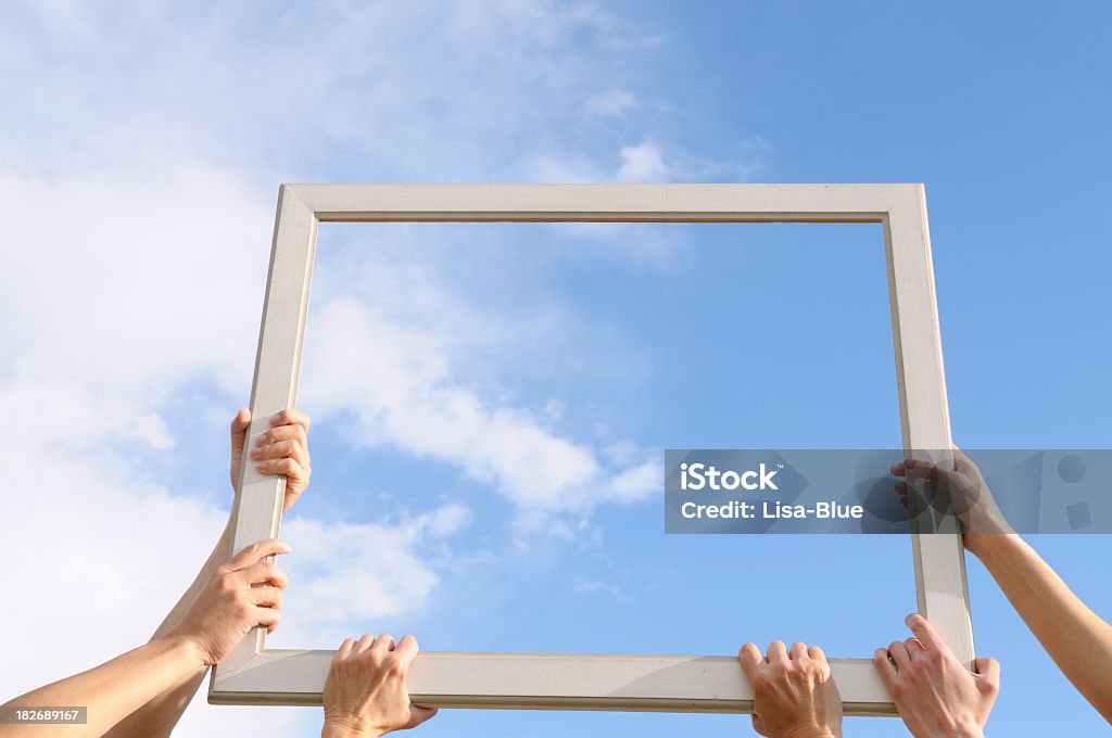 Six Hands Catching Clouds Blue Sky Three women holding a frame and showing clouds. Add your message. Window Stock Photo