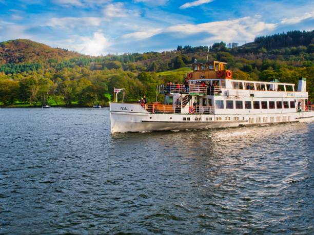 Windermere, United Kingdom – November 14, 2023: The windeermere lake steamer teal approaching Lakeside terminal