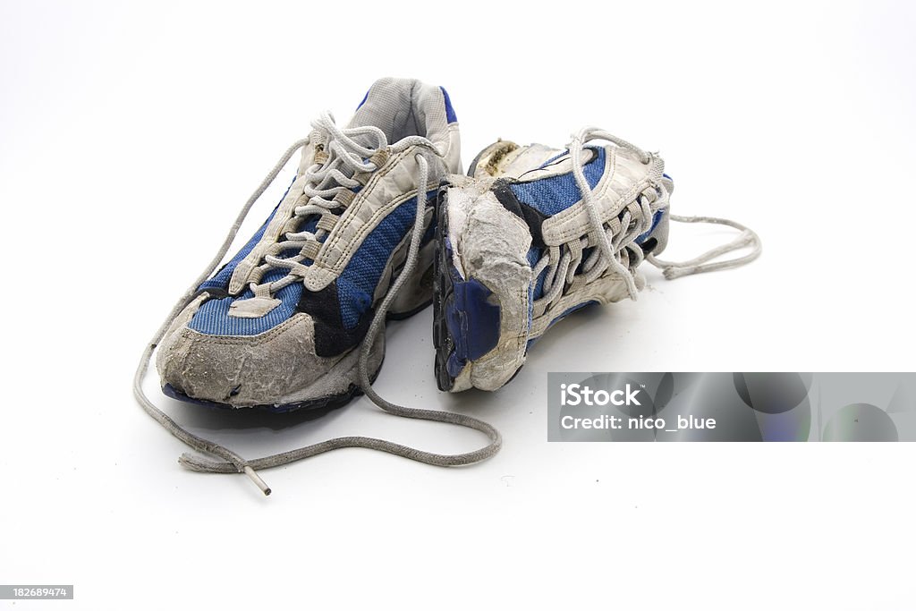 Old wornout trainers  Sports Shoe Stock Photo