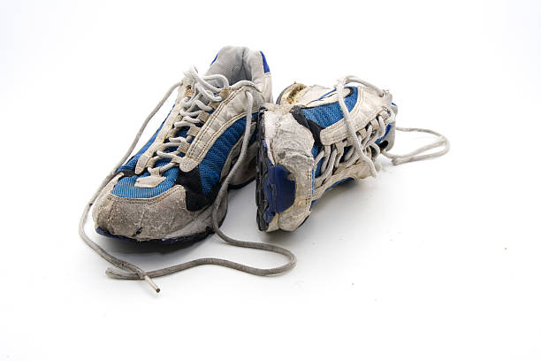 Old wornout trainers stock photo