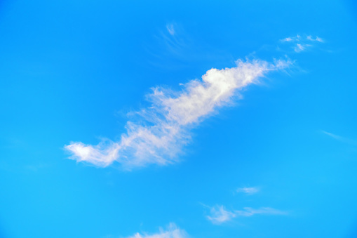 Elongated cloud on blue sky