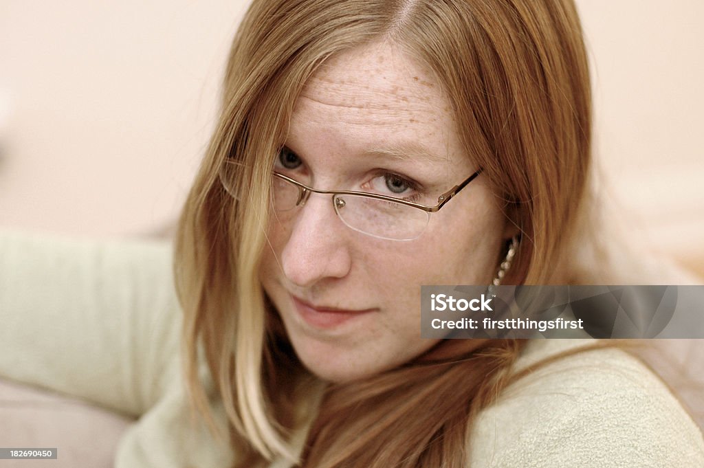 CasualWoman3 woman looking over the top of her glasses with a questioning expression Adult Stock Photo