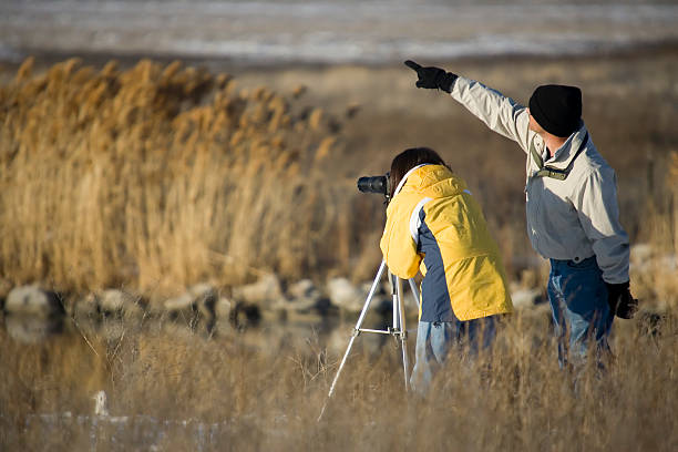 istock Birdwatching Couple-man pointing 182690537