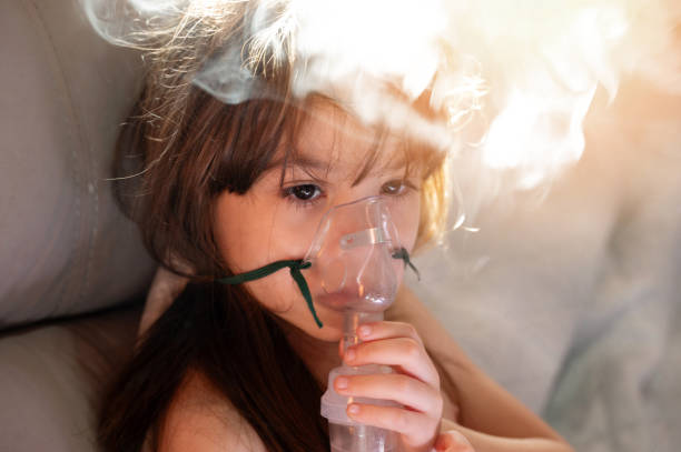 istock Face girl kid with breathing mask 1826907784