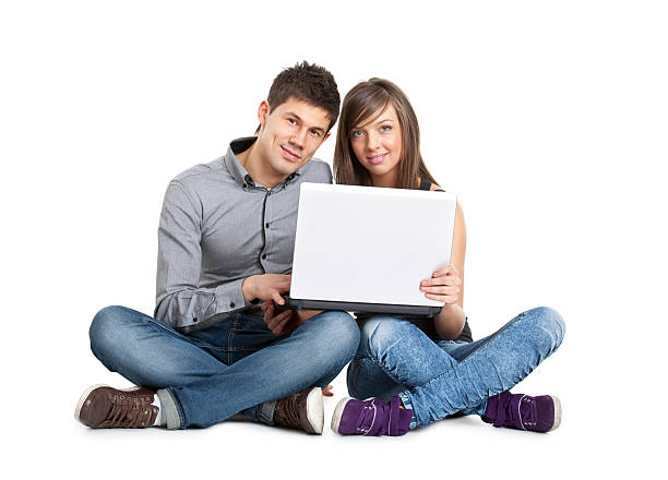 istock young attractive couple with laptop 182690855