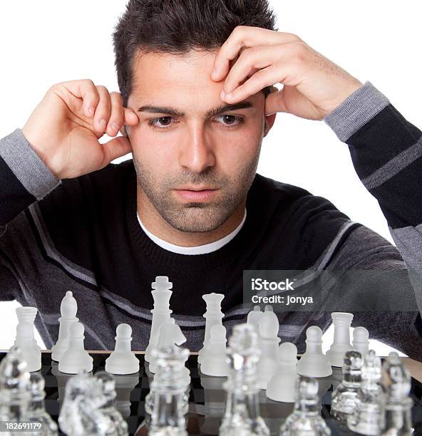 Handsome Male Model Considers His Next Chess Move Stock Photo - Download  Image Now - Chess, Chess Piece, Contemplation - iStock