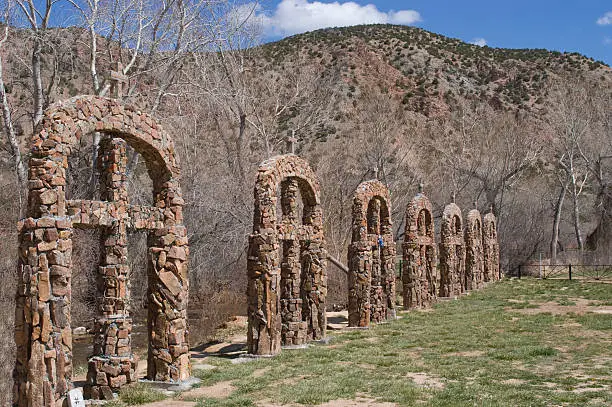 "Several of the Stations of the Cross outside of Santuario de Chimayo Church, Chimayo, New Mexico.  In 1813, Bernardo de Abeyta, a Penitente priest, petitioned the Catholic church to erect a building where several miracles had been reported.  Chimayo has since been called the Lourdes of America, enticing pilgrimages by thousands who come to receive spoonfuls of the miraculous soils in the area."
