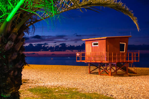 istock lifeguard cabin on pebble beach in Batumi in night 1826914132