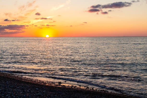 istock view of Black Sea water and setting sun from beach 1826914722