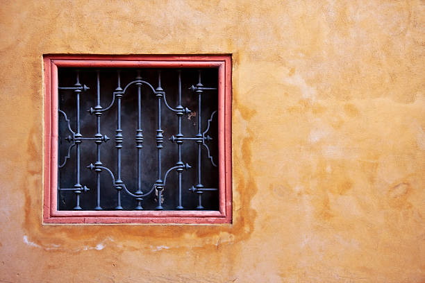 istock Window in Arabic Style on a Yellow Plaster Wall 182691690