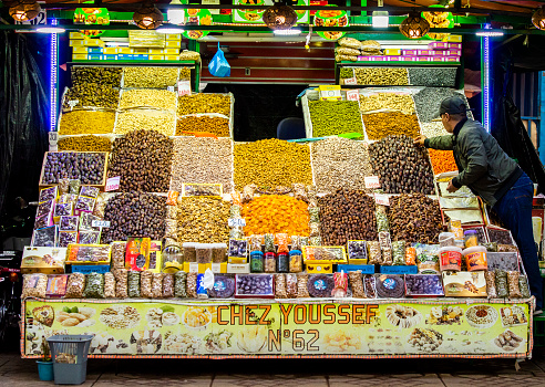 Marrakech, Morocco, April 8th, 2023. A market food stall with colourful dried fruits  at Marrakech Jemaa el-Fnaa Square.