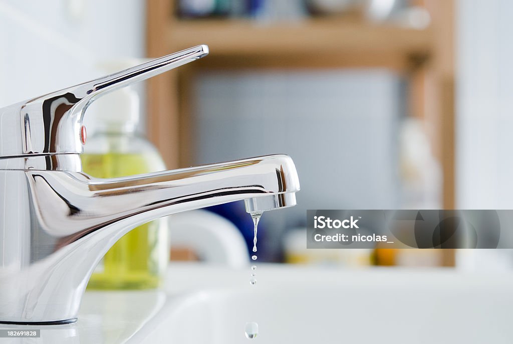 Bathroom Faucet A dripping faucet Faucet Stock Photo