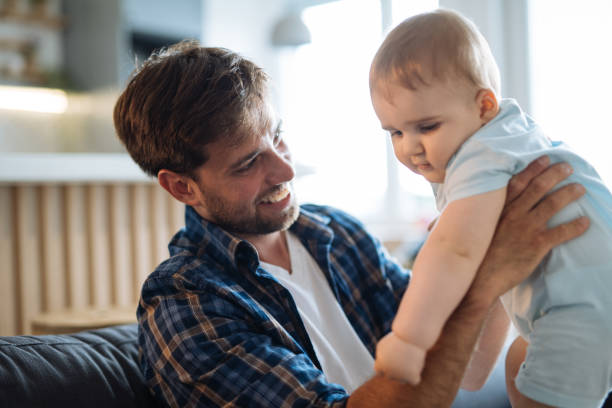 istock Father playing with baby boy 1826918433