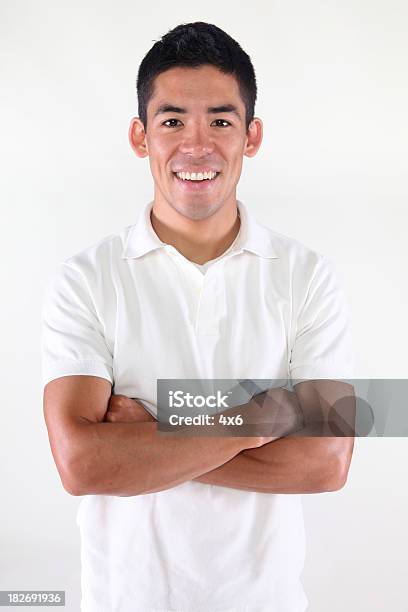 Foto de Casual Homem Dobrar Os Braços e mais fotos de stock de Camisa Pólo - Camisa Pólo, Homens, Asiático e indiano