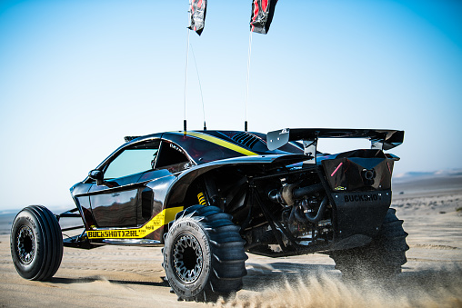 Doha, Qatar, February 23, 2018: Off road buggy car on the sand dunes of the Qatari desert.