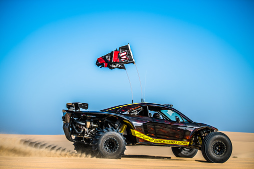 Doha, Qatar, February 23, 2018: Off road buggy car on the sand dunes of the Qatari desert.